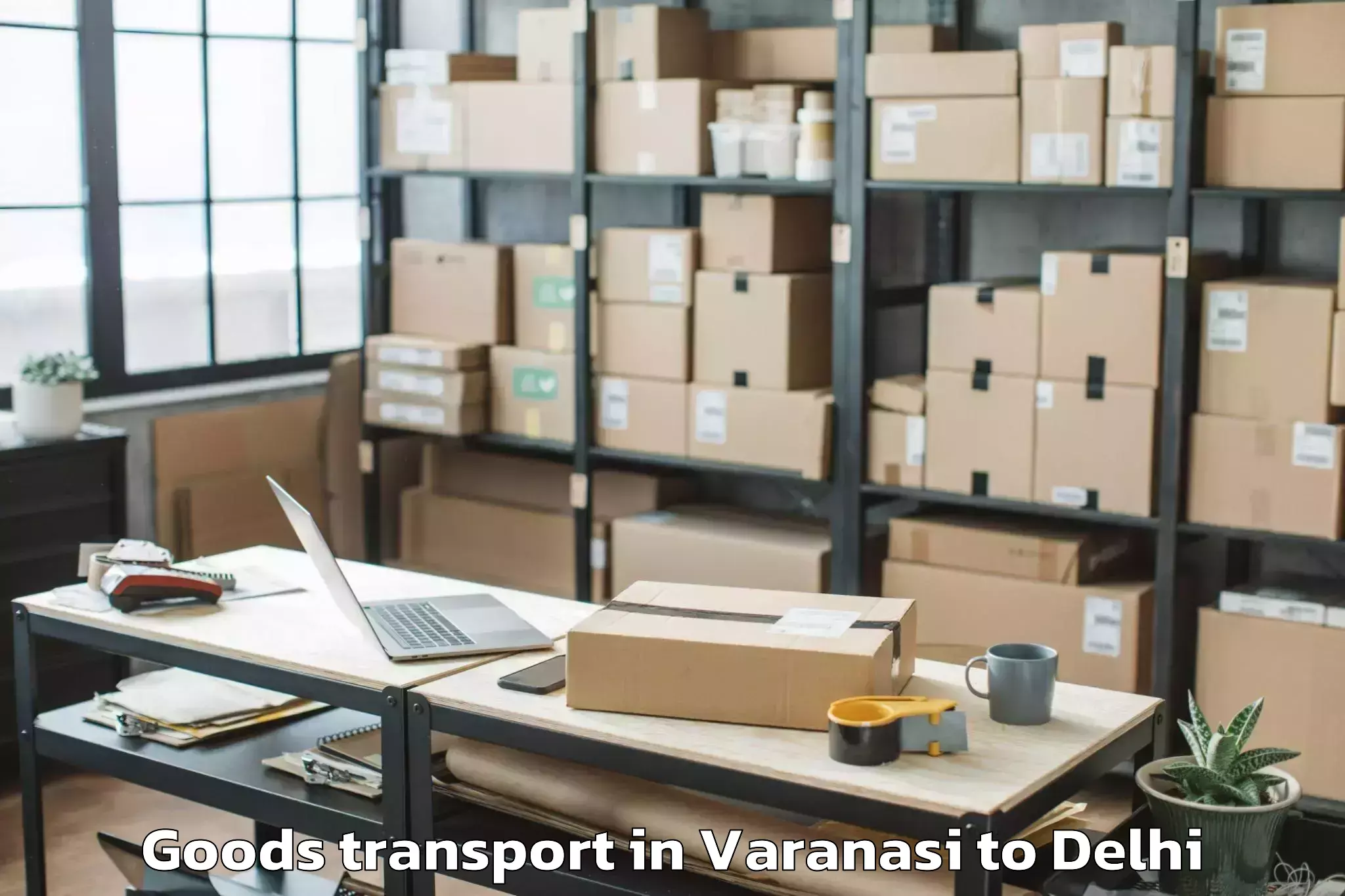 Book Varanasi to Dlf Promenade Mall Goods Transport Online